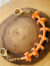 Orange Puakenikeni Flower Bag Charm Lei